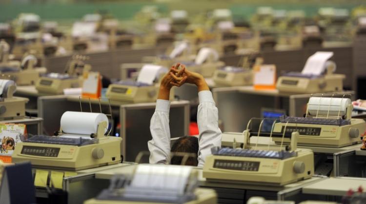 Traders work at the stock exchange in Hong Kong on January 3, 2011. Hong Kong shares rose 1.74 percent, lifted by a surge of optimism for the year ahead, particularly the US economy. (Mike Clarke/AFP/Getty Images)