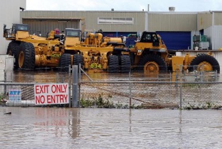 Giant mining trucks are engulfed by flood waters near Rockhampton on January 6 (Getty Images)