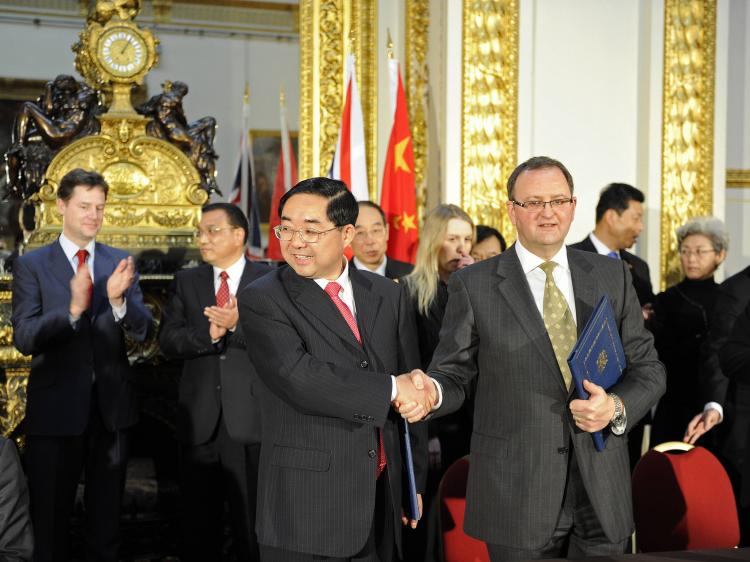 Panda deal: Britain's Deputy Prime Minister Nick Clegg (L) applauds with China's Vice Premier Li Keqiang (2nd, L) as the Vice Minister of China State Forestry Administration (3rd, L) shakes hands with the Chair of the Royal Zoological Society of Scotland. (Paul Hackett - WPA Pool/Getty Images)