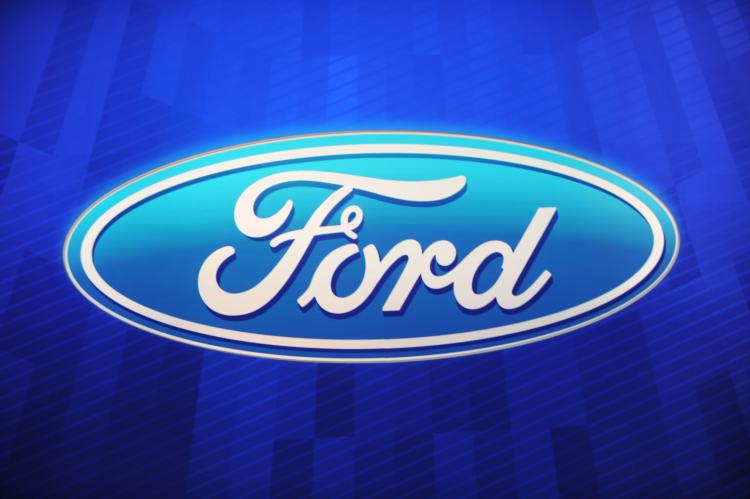 The Ford Motor Company logo is sen during the first press preview day at the 2011 North American International Auto Show January 10, 2011 in Detroit, Michigan. (Stan Honda/AFP/Getty Images)