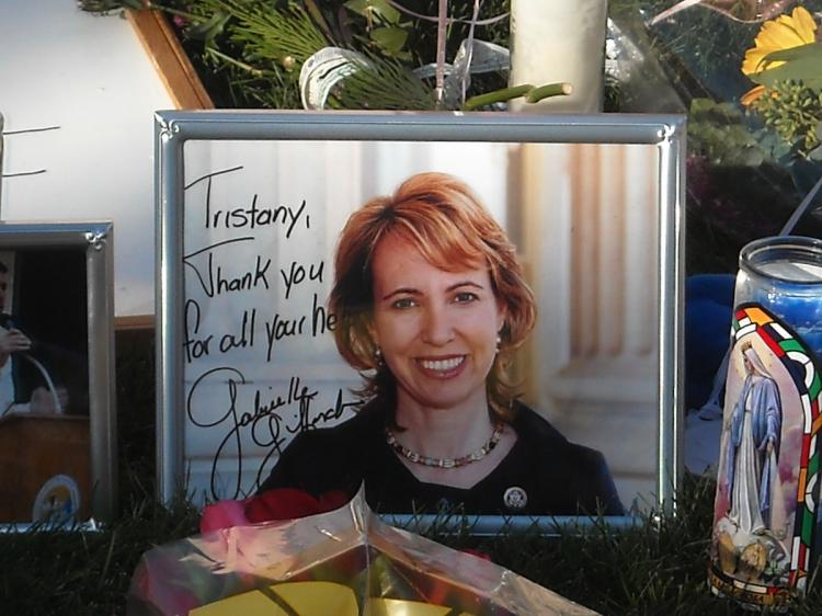 Portrait of Congresswoman Gabrielle Giffords at a makeshift memorial outside the hospital in Tucson, Arizona where she is in critical condition on January 10, 2011. On Tuesday Doctors said that she is now able to draw breath on her own.   (Shaun Tandon/Getty Images )