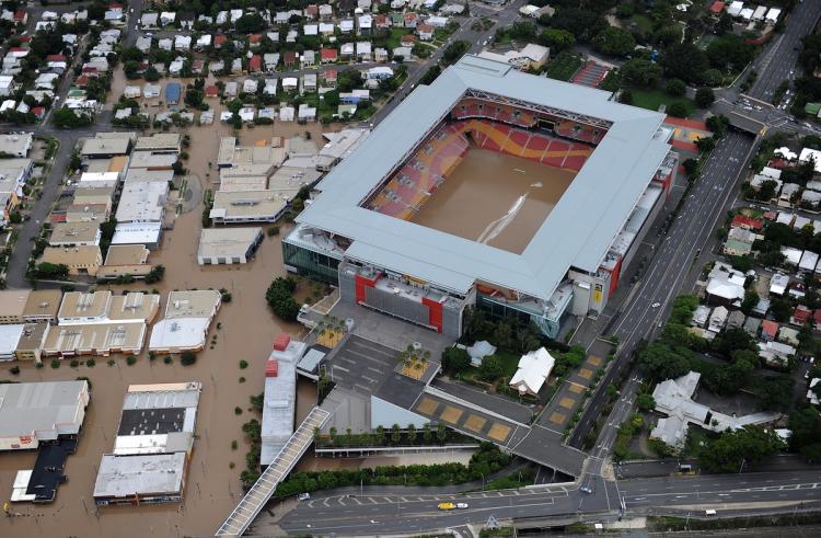 Aerial photograph of the iconic Suncorp Stadium (C) filled with the murky flood waters of the Brisbane River as flood waters devastate much of Brisbane on January 13, 2011. Australia's third-largest city awoke to a 'war zone' with whole suburbs under water and infrastructure smashed as the worst flood in decades caused wide destruction.  (Torsten Blackwood/Getty Images)