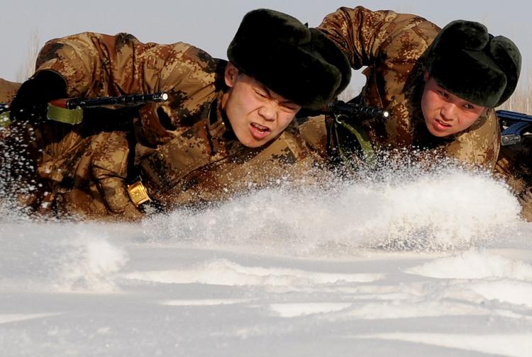 Chinese soldiers undergo a training session in Hami, northwest China's Xinjiang region on January 12, 2011.  (STR/Getty Images)