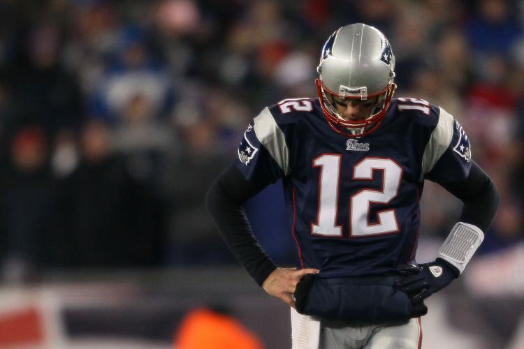 Tom Brady of the New England Patriots looks on near the end of their 28 to 21 loss to the New York Jets in their 2011 AFC divisional playoff game at Gillette Stadium on January 16, 2011 in Foxboro, Massachusetts. (Elsa/Getty Images)