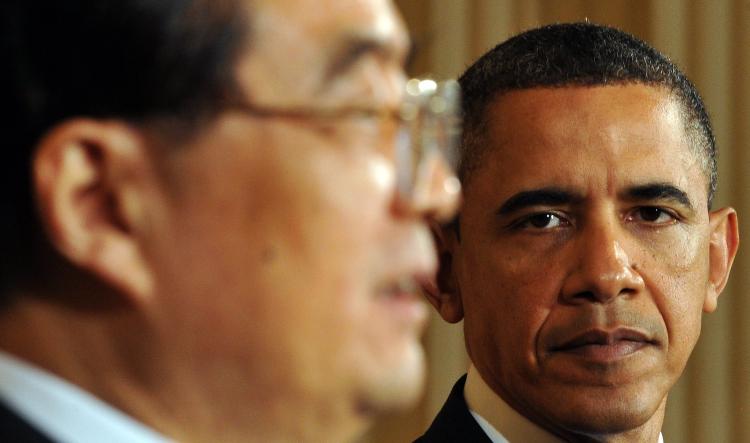 President Obama listens to Chinese leader Hu Jintao, as he answers a question about the human rights issue in China during a press conference in the East Room at the White House in Washington, DC, on January 19.   (Jewel Samad/Getty Images)