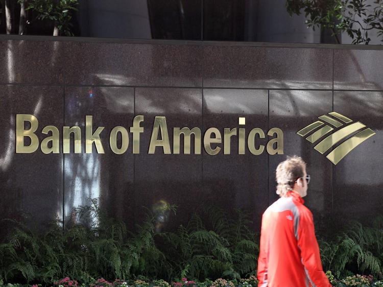 POSSIBLE COLLUSION: A pedestrian walks by a Bank of America branch office this past January in San Francisco, California. Bank of America was one of four of the world's largest banks which were served subpoenas for possible colluding over LIBOR rates be (Justin Sullivan/Getty Images)
