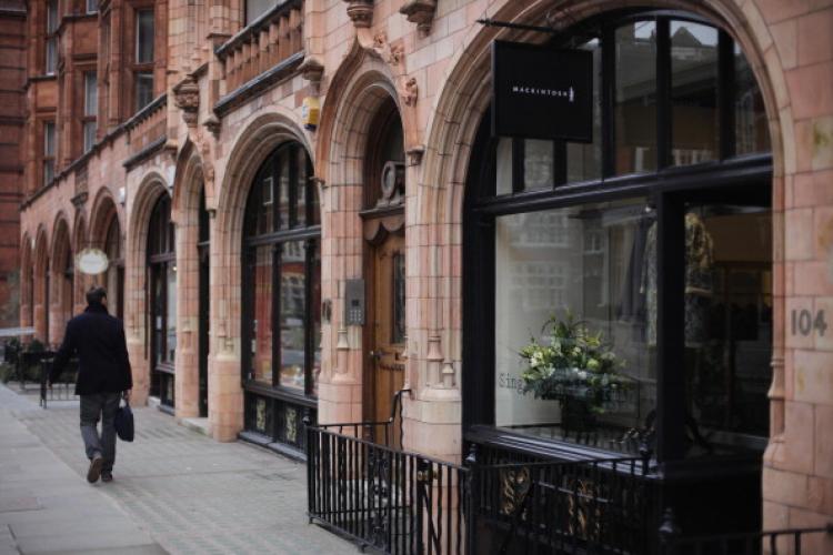 A man walks by the Mackintosh store in Mayfair on January 24, 2011 in London, England. Despite the expected retail slump confirmed by Office of National Statistics's (ONS), sales of luxury goods are booming, with many companies posting large profits.  (Photo by Dan Kitwood/Getty Images)