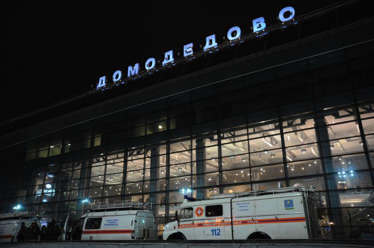Vans of the Russian Emergencies Ministry wait outside Moscow's Domodedovo international airport on January 24, 2011, shortly after an explosion. A suspected suicide bombing on January 24 killed at least 35 people and wounded over 100 at the airport in an attack described by investigators as an act of terror.  (Andrey Smirnov/Getty Images )