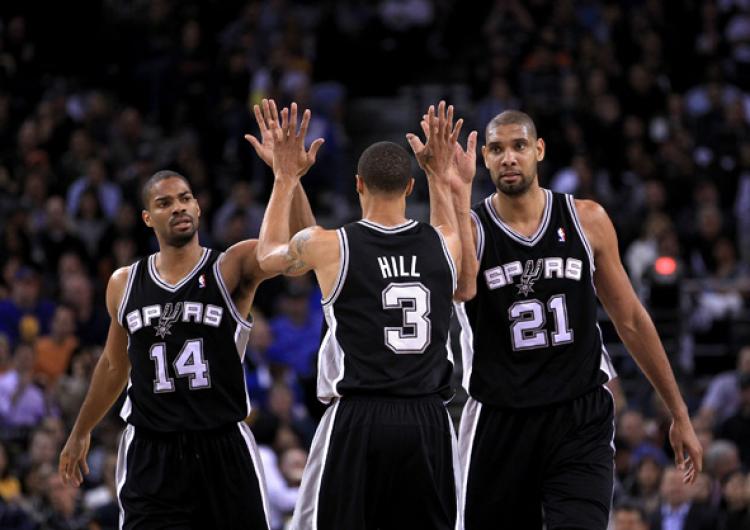 George Hill #3 of the San Antonio Spurs is congratulated by Tim Duncan #21 and Gary Neal #14 after Hill got fouled during their game against the Golden State Warriors at Oracle Arena on January 24, 2011 in Oakland, California. (Ezra Shaw/Getty Images) George Hill #3 of the San Antonio Spurs is congratulated by Tim Duncan #21 and Gary Neal #14 after Hill got fouled during their game against the Golden State Warriors at Oracle Arena on January 24, 2011 in Oakland, California. (Ezra Shaw/Getty Images)