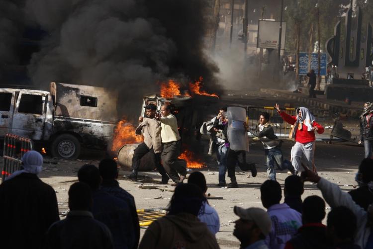 Egyptian demonstrators burn a riot police car during a protest in the northern city of Suez on January 28, 2011 demanding the ouster of President Hosni Mubarak.  (AFP/Getty Images)