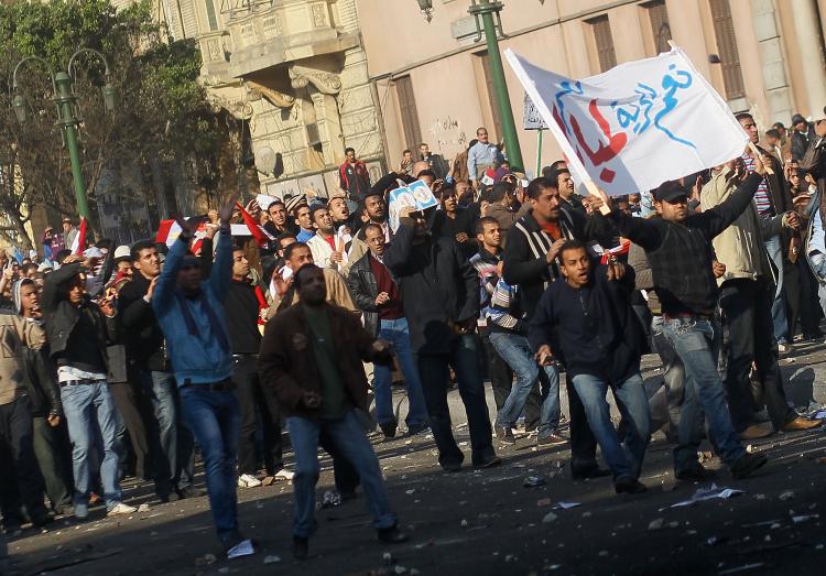 Supporters of embattled Egyptian president Hosni Mubarak advance during a clash between pro- and anti-Mubarak protesters Feb. 2, 2011 in Tahrir Square in Cairo, Egypt. (Chris Hondros/Getty Images)