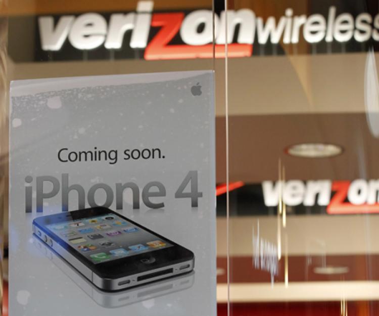 ANTICIPATION: A sign on a window at the Verizon Store announces of the arrival of Apple's iPhone in Orem, Utah. The iPhone will be available on Verizon's network starting Feb. 10.  (George Frey/Getty Images )