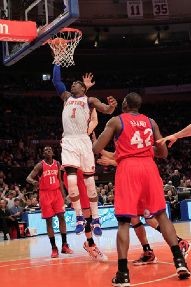 LEADING THE WAY: Amar'e Stoudemire breaks through the Philadelphia 76ers defense for a slam dunk on Sunday.