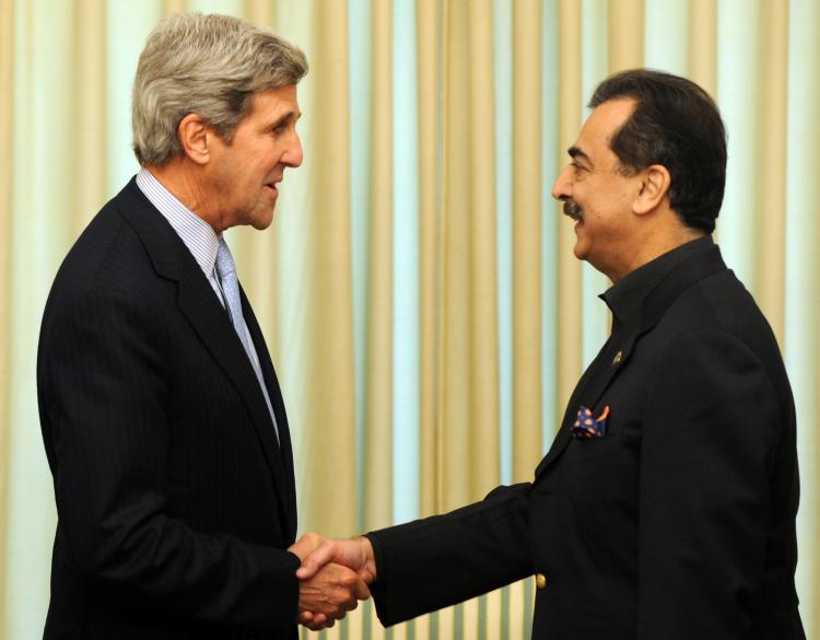 John Kerry (L) shakes hands with Pakistan's Prime Minister Yousuf Raza Gilani prior to a meeting at The Prime Minister House in Islamabad on Feb. 16. (Aamir Qureshi/AFP/Getty Images)