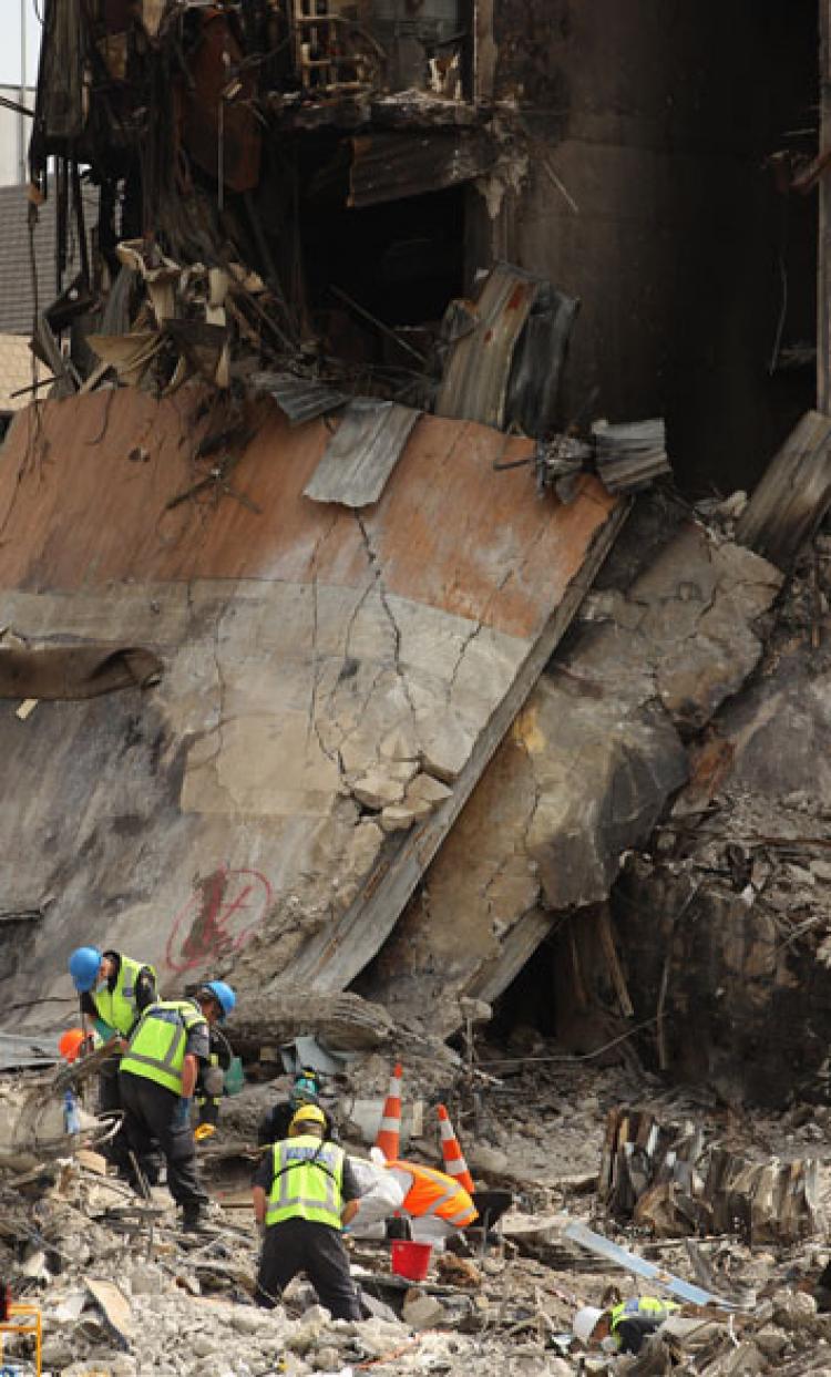 Search and rescue teams scour through the wreckage of the CTV building on February 28, in Christchurch, New Zealand. The death toll from the earthquake has risen to 148 and the hope for finding survivors is fading as rescuers search through debris for over 200 still missing. ( Phil Walter/Getty Images)