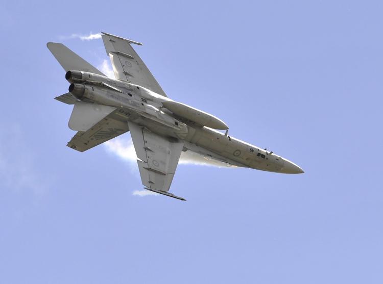Pictured above, a Royal Australian Air Force F-18 performs. On April 6, 2011, a Navy F-18 crashed in central California, killing two. (Paul Crock/AFP/Getty Images)