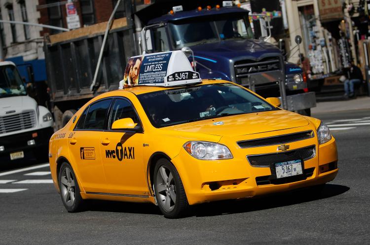 NEW YORK, NY - MARCH 01: A taxi cab drives on a street March 1, 2011 in New York City. (Chris Hondros/Getty Images)