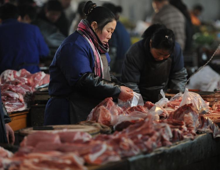 A Chinese vendors sell pork at a market in Hefei, in east China's Anhui province on March 5. Meat products tainted with toxic lean meat powders have been found again in east China's Nanjing city, generating fear and worries among consumers. (STR/Getty Images)