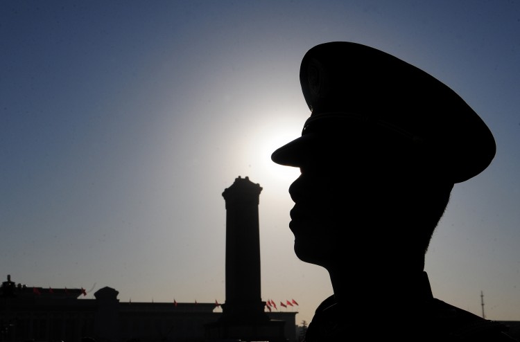 A military guard mans his position on Tiananmen Square ahead of an ongoing session of the National People's Congress, at the Great Hall of the People in Beijing on March 10, 2011.  (Frederic J. Brown/AFP/Getty Images)