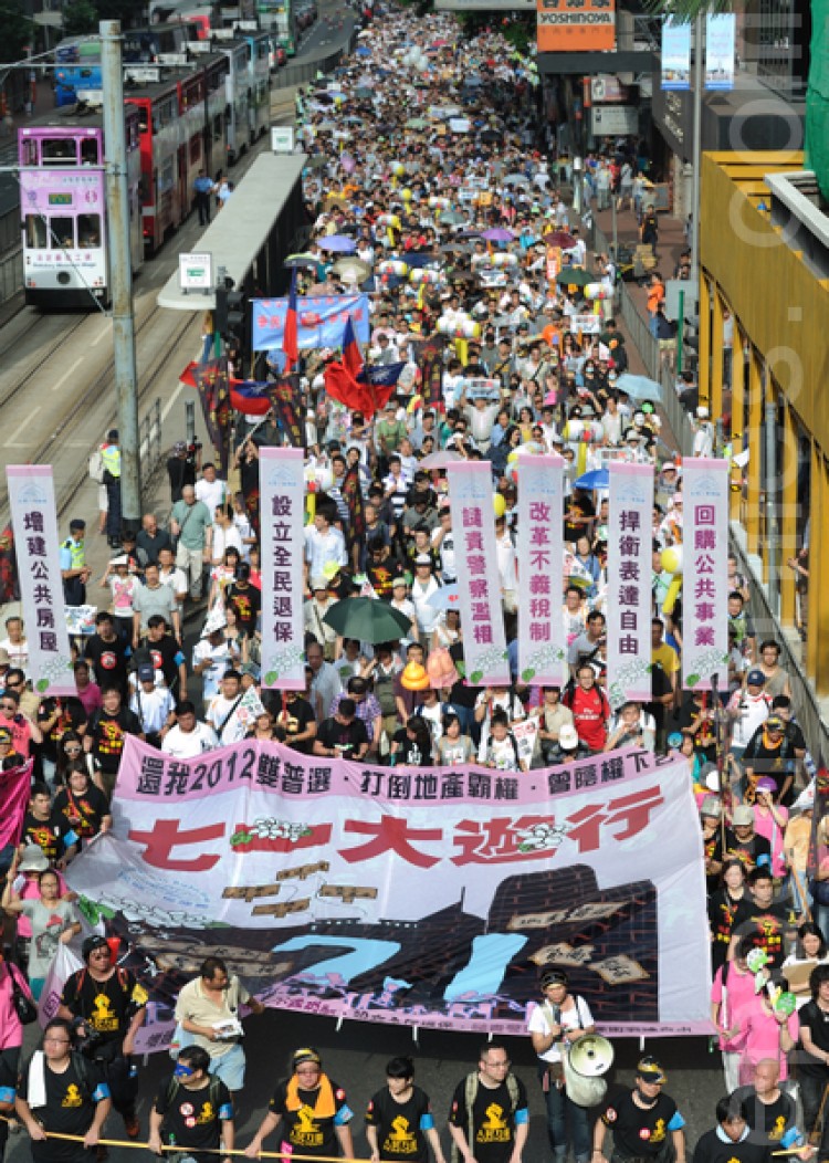 Hong Kong's annual July 1 parade featured some very public acts of civil disobedience in response to authorities' attempts to restrict an event famous for championing Hong Kong's freedom.  (Song Xianglong/Epoch Times Staff)