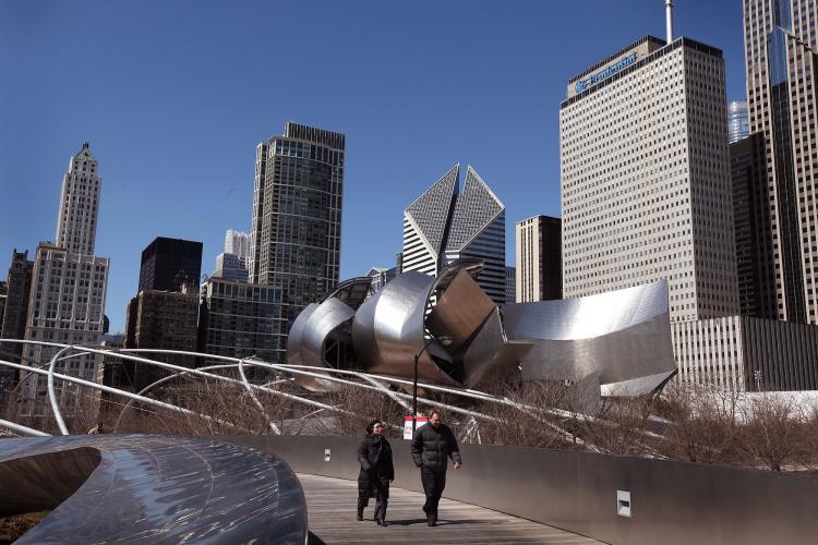 People walk past One Prudential Plaza (R) as it towers over the north end of Millennium Park on March 28, 2011 in Chicago, Illinois. (Scott Olsen/Getty Images )