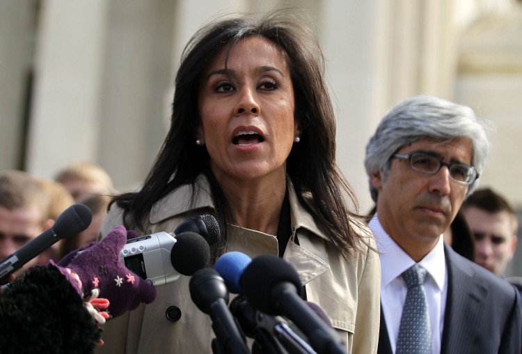 WAL-MART: Wal-Mart's executive vice president for people Gisel Ruiz (L) speaks to the media in front of the U.S. Supreme Court as Theodore Boutrous, lead attorney for Wal-Mart in the Dukes v Wal-Mart case, looks on March 29 in Washington. (Alex Wong/Getty Images)