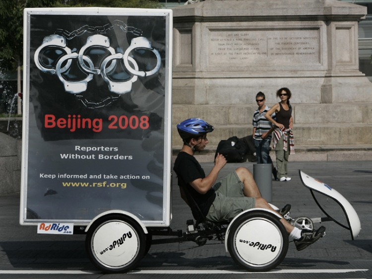 Bikers with mobile billboards from the Reporters Without Borders group launch an international campaign in New York 07 August 2007 on the 2008 Summer Olympic Games in Beijing. (Timothy A. Clary/AFP/Getty Images)