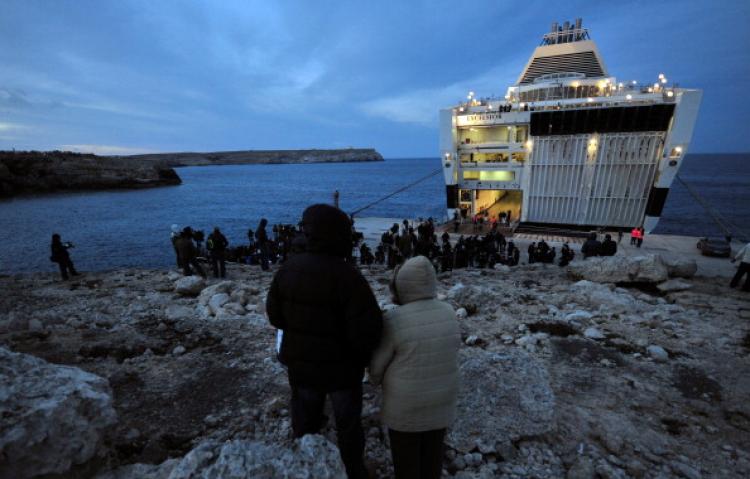 Tunisian would-be immigrants await to be transferred out of the Italian island of Lampedusa on March 30, 2011. (Alberto Pizzoli/AFP/Getty Images)