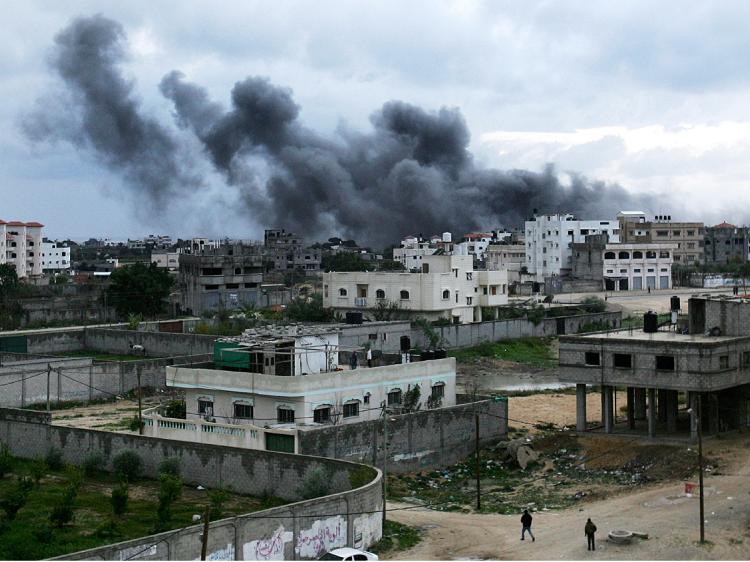 Smoke billows from a mosque following an Israeli air raid December 31, 2008, in Gaza City. Hamas uses mosques for storing and making missiles.  (Abid Katib/Getty Images)