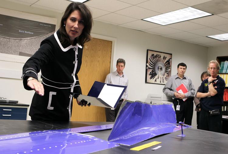 National Transportation Safety Board Chairman Deborah Hersman points at the section of the fuselage skin (R) which was torn from a Southwest Boeing 737-300 aircraft during a news briefing April 5, 2011 at the National Transportation Safety Board headquart (Alex Wong/Getty Images )
