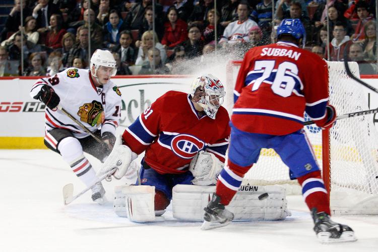 Carey Price (C) and P.K. Subban played key roles in confirming Montreal's entry into the NHL playoffs on Tuesday night against Chicago. (Richard Wolowicz/Getty Images)