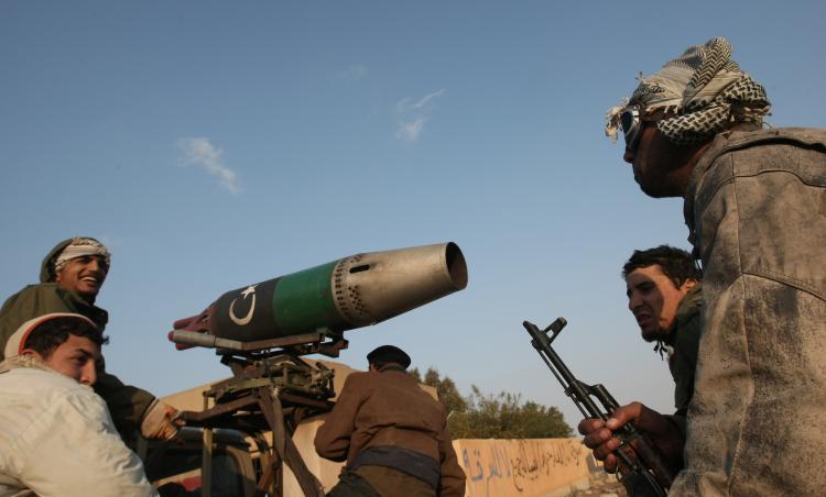 Libyan rebel fighters are pictured at the entrance of the eastern city of Benghazi on April 7, 2011. (Mahmud Hams/AFP/Getty Images)