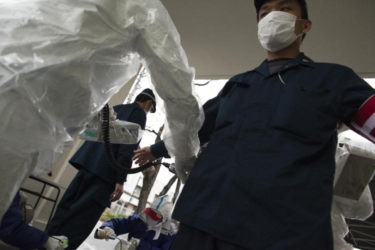 A Japanese policeman undergoes testing for possible nuclear radiation at screening center about (22 miles) 35 kilometers away from Fukushima Nuclear Power Plant on April 9 in Fukushima prefecture. (Athit Perawongmetha/Getty Images)
