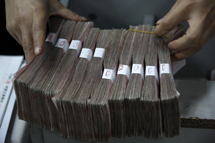 Stacks of Chinese Yuan will now be kept in reserve. (ChinaFotoPress/Getty Images)