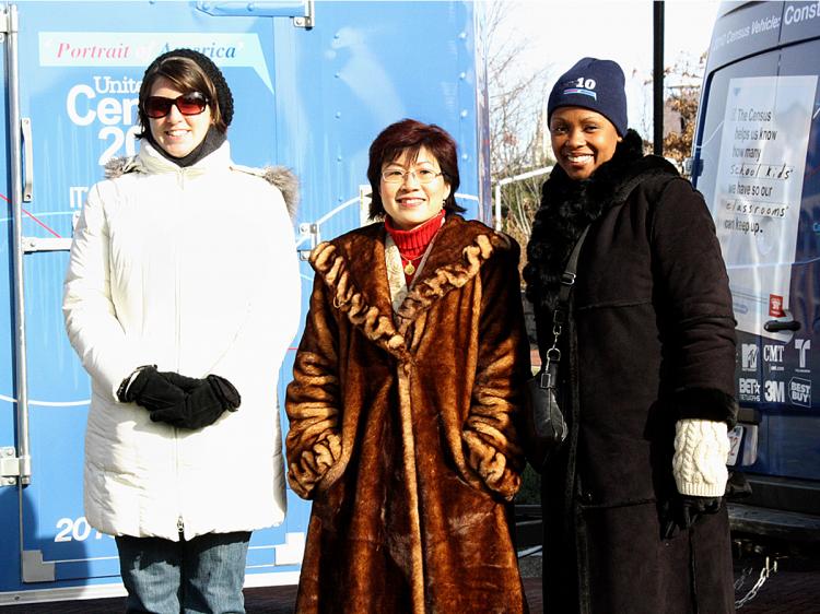 (L) Ms. Monica L. Davis, media specialist for the Philadelphia Regional Census Center, (C) Grace Kong, partnership specialist, and (R) Ms. Lanette M. Swopes, partnership specialist and Road Tour producer stand in front of the Philadelphia census vehicle 'The Constitution' on Jan. 4. (Mia Enache/The Epoch Times)