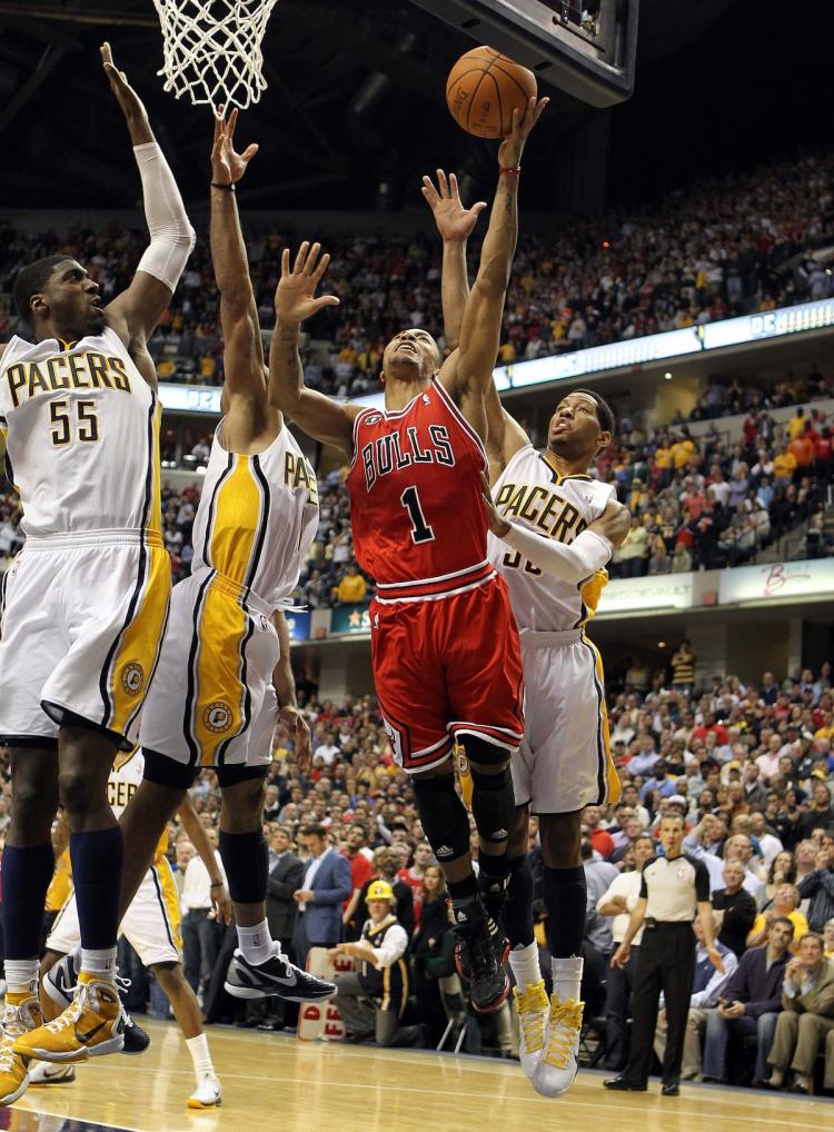 UNTOUCHABLE: Derrick Rose made the game-winning layup on Thursday night in the face of three Indiana players in Game 3.