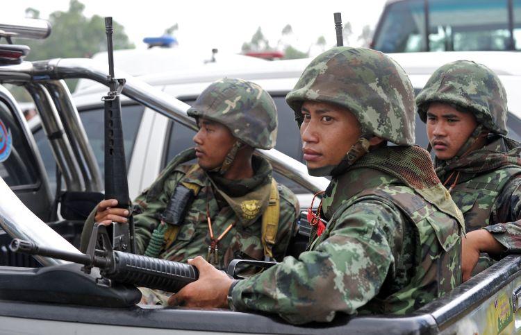Thai soldiers guard during a visit by Thai Prime Minister Abhisit Vejjajiva after a deadly exchange of gunfire between Thai and Cambodian soldiers near the border on April 27. (Pornchai Kittiwongsakul/AFP/Getty Images)