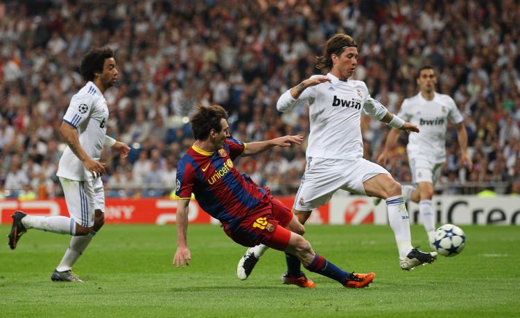 Lionel Messi of Barcelona scores his second goal during the UEFA Champions League semifinal first leg match between Real Madrid and Barcelona at Estadio Santiago Bernabeu on Wednesday. (Alex Livesey/Getty Images)