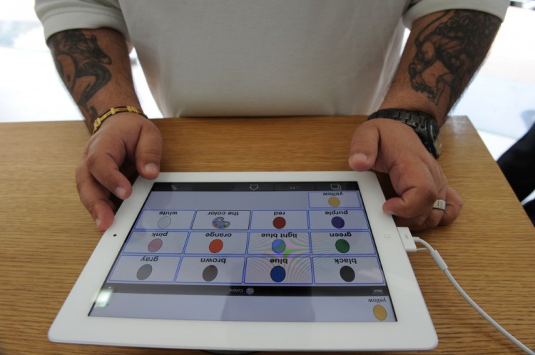 An iPad2 buyer checks out the new product at the counter of an Apple premium reseller outlet in Mumbai on April 29, 2011. (Indranil Mukherjee/AFP/Getty Images)