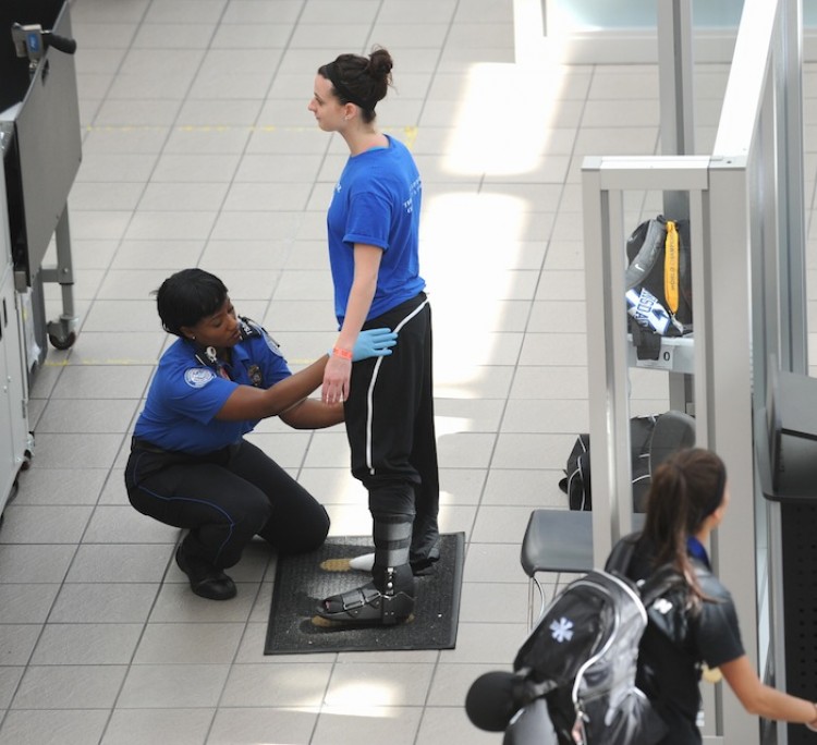 A passenger is patted down by a Transportation Security Administration(TSA) agent May 2,  at Orlando International Airport in Orlando, Florida.  (Stand Honda/Getty Images)