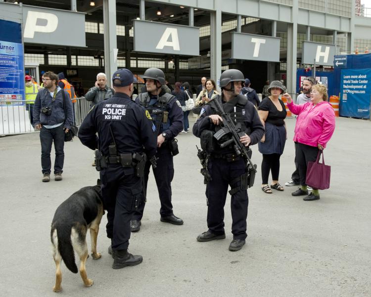 New York City police officers stand guard outside the Path train entrance near the World Trade Center May, 2 in New York. Al-Qaeda leader Osama bin Laden was shot dead deep inside Pakistan Monday in a night-time helicopter raid by US commandos,ending a decade-long manhunt for the mastermind of the 9/11 attacks. (Don Emmert/Getty Images)