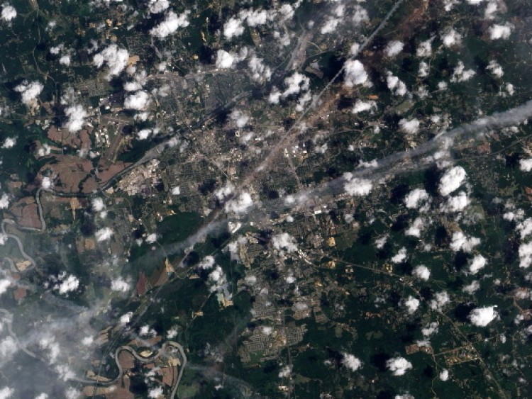 A NASA Earth Observatory photo; destruction can be seen in the track left by a tornado on May 2, 2011 as seen from space of Tuscaloosa, Alabama. (NASA via Getty Images)
