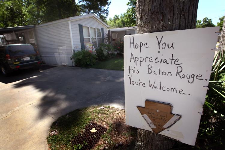 A Butte LaRose homeowner leaves a message for Baton Rouge on May 15. Most of the residents of the small town of Butte LaRose are packing their possessions or moving their entire homes because the town is expected to be severely flooded after the Army Corps of Engineers opened the Morganza Spillway. (Scott Olson/Getty Images)