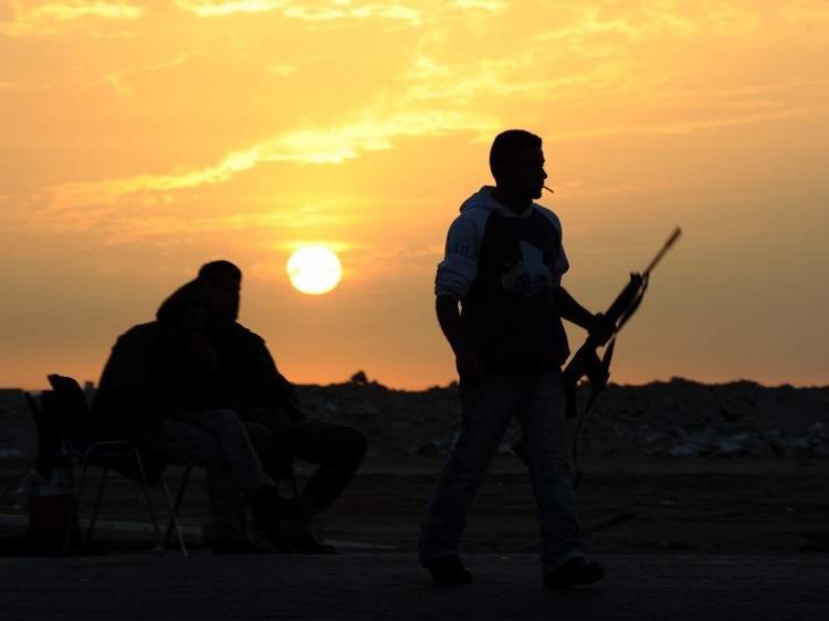 Libyan rebel fighters on the frontlines at sunset (Saeed Khan/AFP/Getty Images)