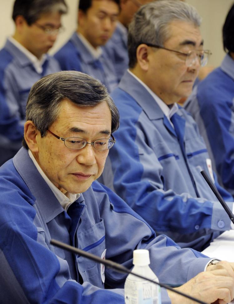 Tokyo Electric Power Co. President Masataka Shimizu (front L) attends his press conference with his successor and current managing director Toshio Nishizawa (R) on the company's financial result at its headquarters in Tokyo on May 20. (Toshifumi Kitamura/AFP/Getty Images)