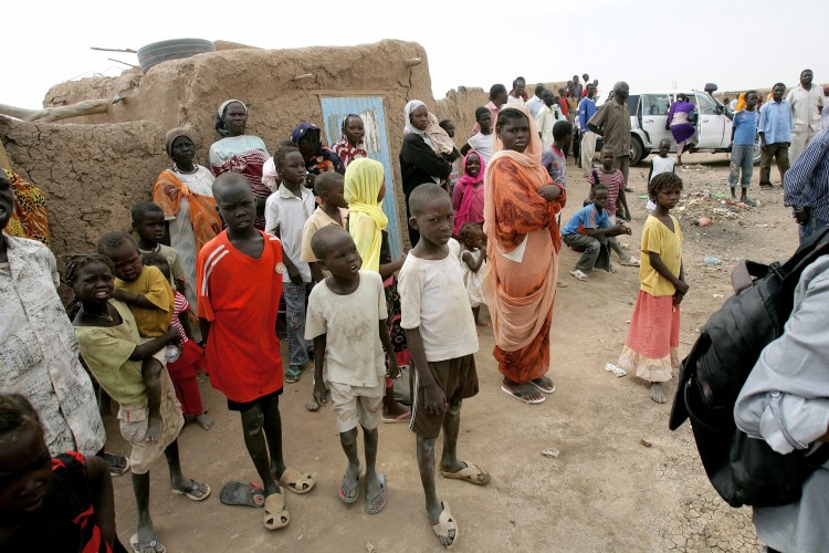 Children and women at the Mandela camp for displaced southern Sudanese, 30 kms south of the capital Khartoum on May 22, 2011. (Ashraf Shazly/AFP/Getty Images)