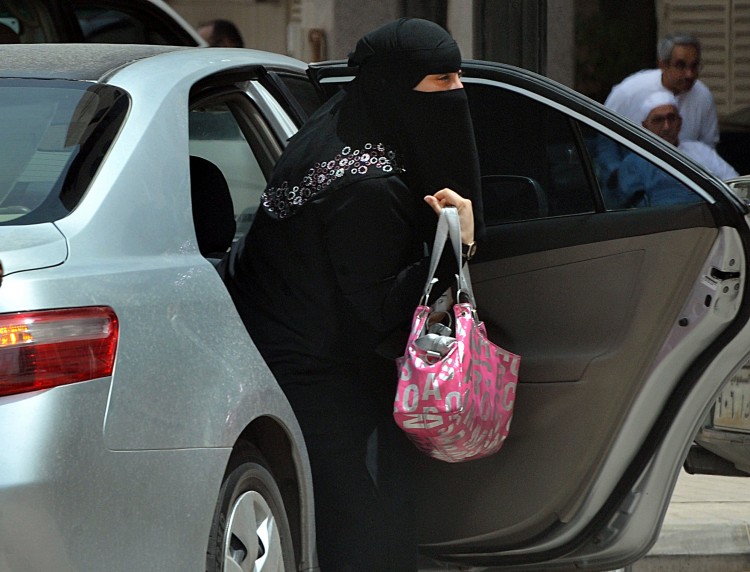 A Saudi woman gets out of a car after being given a ride by her driver in Riyadh on May 26, 2011. (Fayez Nureldine/AFP/Getty Images)