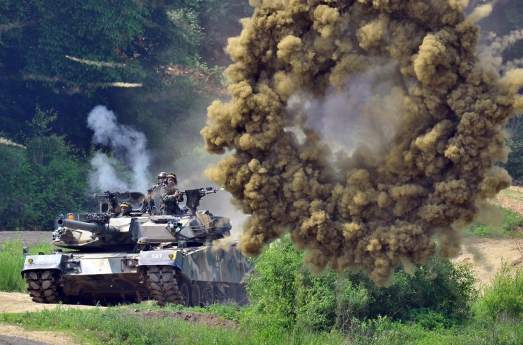 A South Korea's K1 tank fires smoke shells during a joint military drill between South Korea and the US in Paju near the inter-Korean border on June 8, 2011 aimed at deterring North Korea's military threat. (Jung Yeon-Je/AFP/Getty Images)