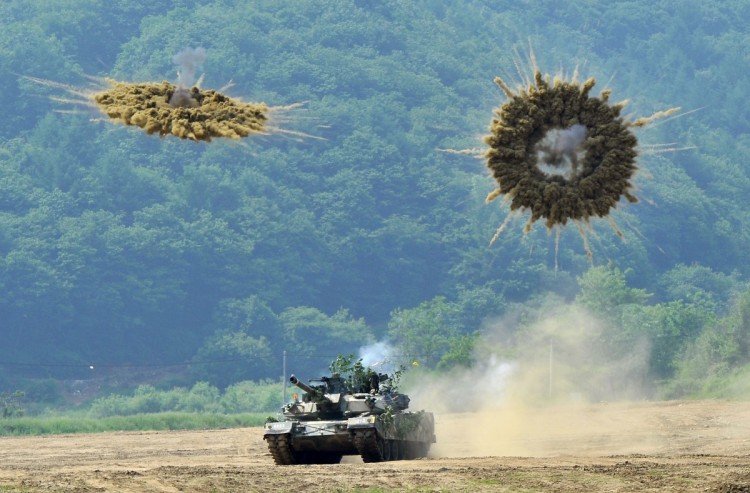 A South Korea's K1 tank fires smoke shells during a joint military drill between South Korea and the US in Paju near the inter-Korean border on June 8, 2011 (Jung Yeon-Je/AFP/Getty Images)