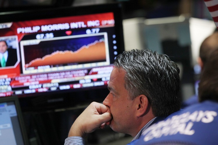 A trader works on the floor of the New York Stock Exchange on June 10. (Spencer Platt/Getty Images)